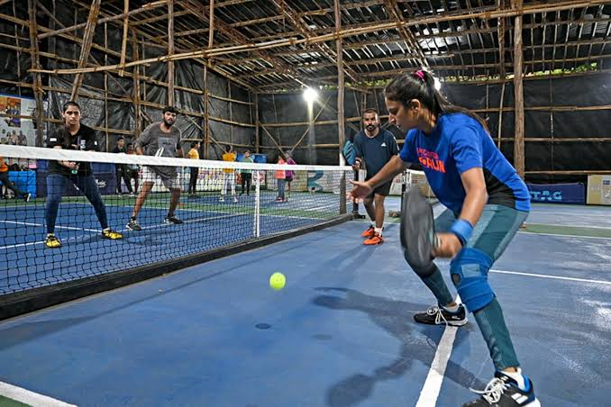 Players taking part in a recreational court-sport session